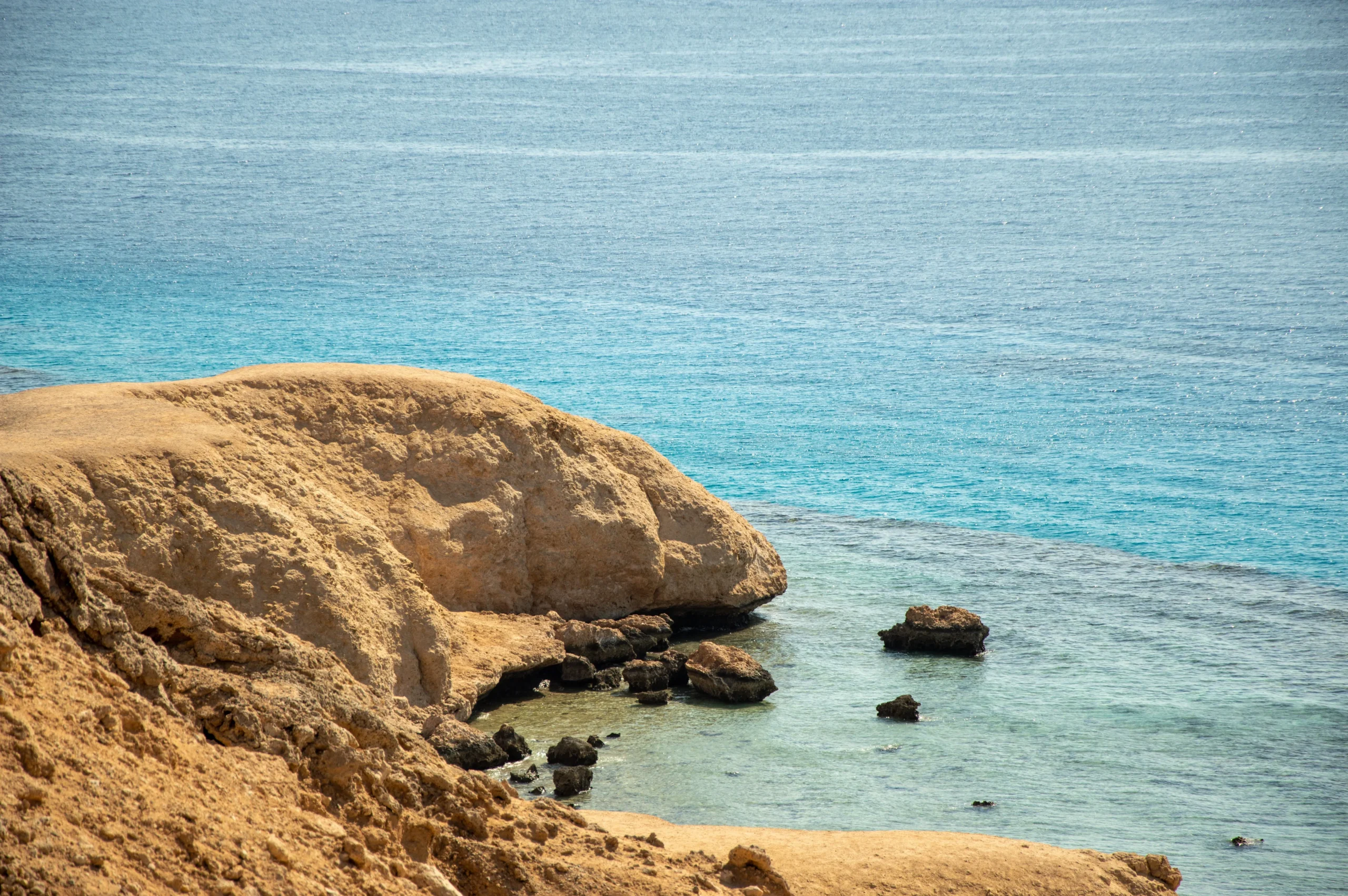 Discover Oman's beautiful rocky coastlines and crystal-clear waters on a scenic island boat tour.