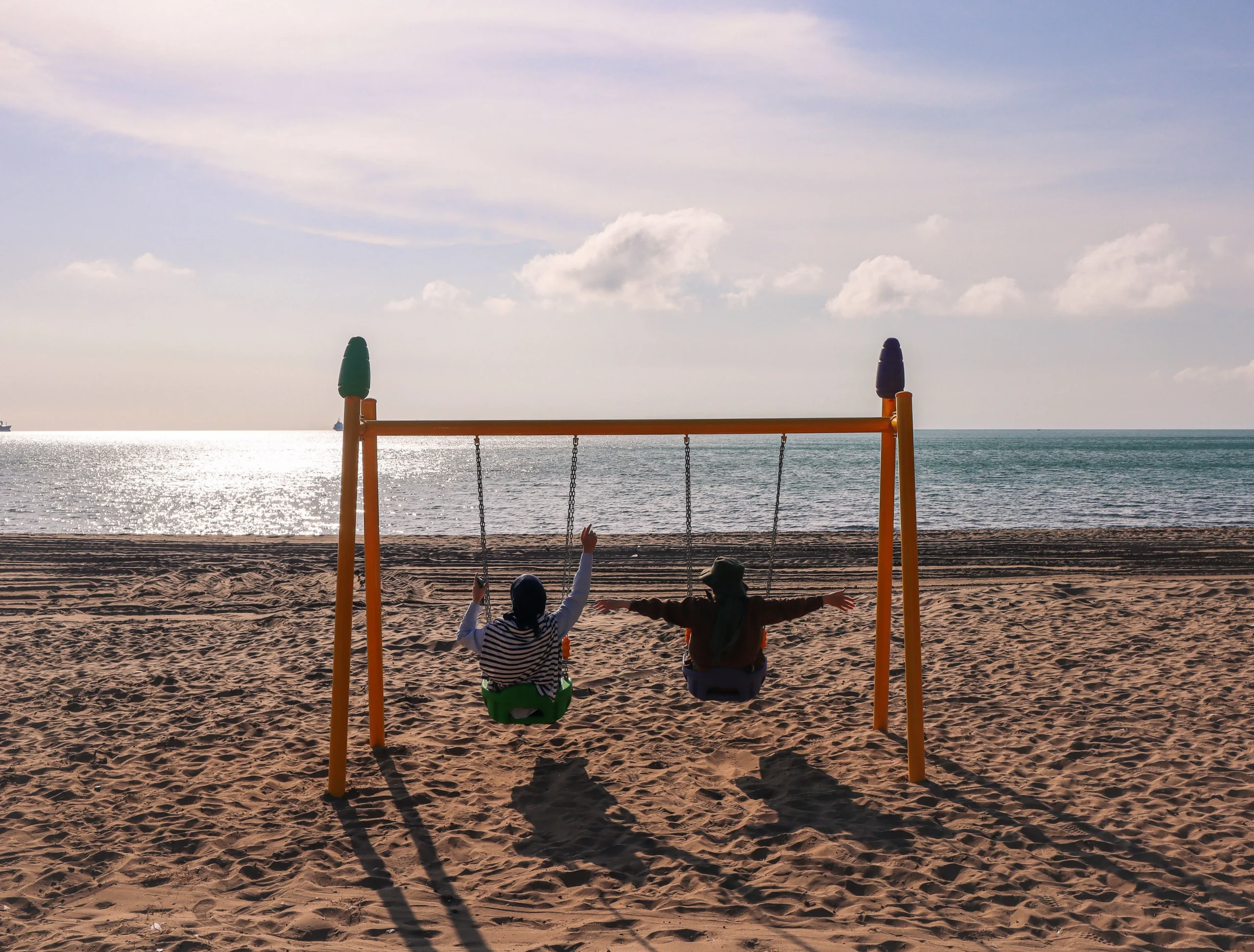 Relaxing on Bandar Khairan beach scaled | Ahlan Arabia Tours